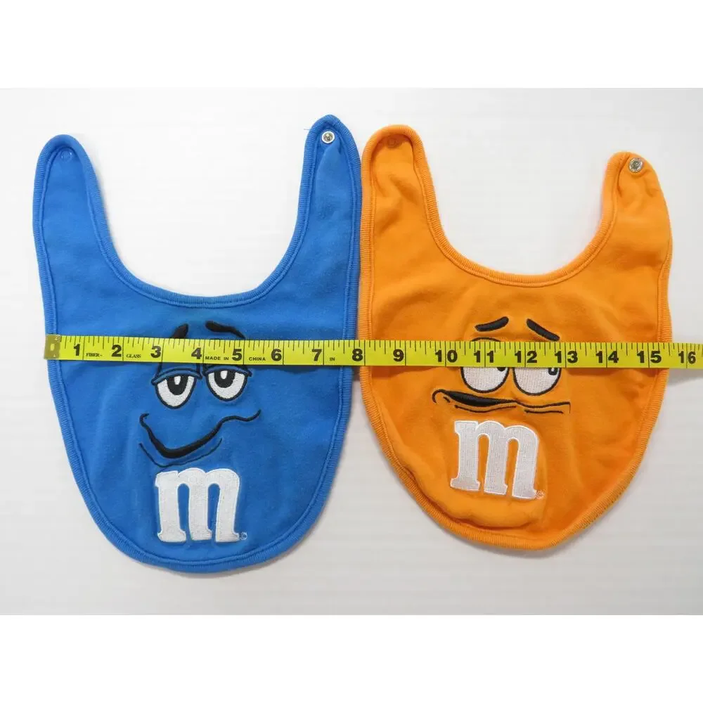 Set of 2 M&M Baby Bibs 100% Cotton Blue Orange Novelty Collectible Chocolate
